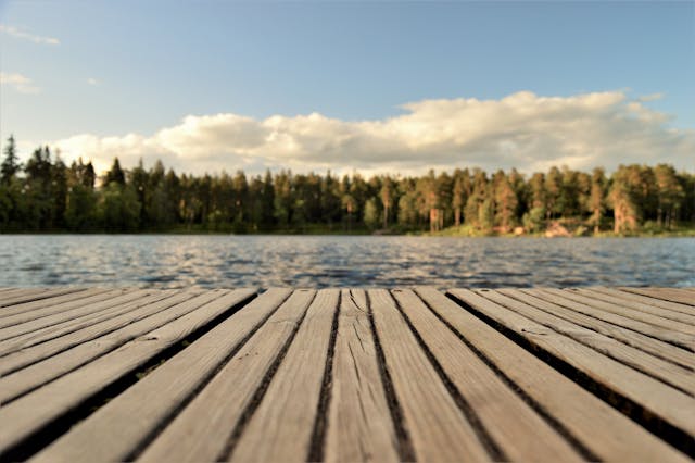 a dock on a lake on a sunny day