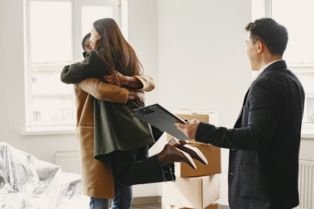 two people hugging after moving into a new place